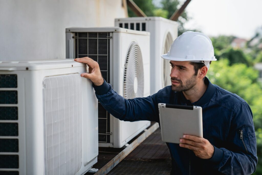 Air Conditioning Maintenance Contracts with Refresh Cooling Engineers checking air conditioning cooling system of a major building or industrial facility.