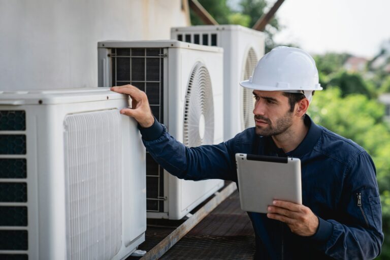 Engineers checking air conditioning cooling system of a major building or industrial facility.